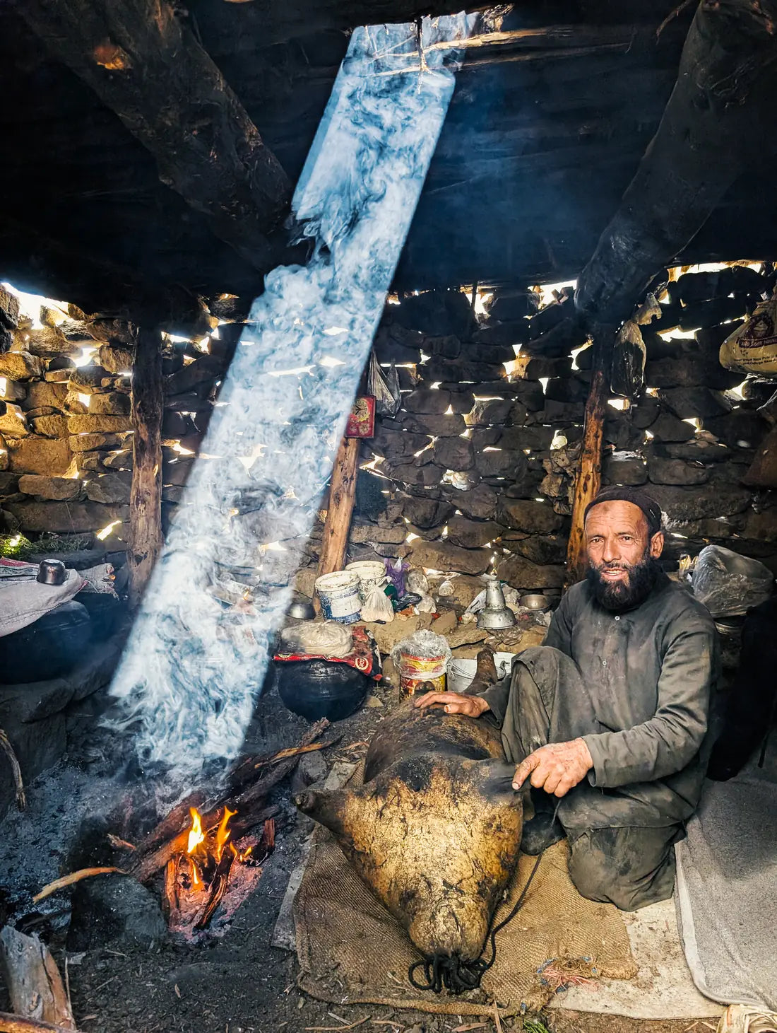 A local producer beside a traditional hearth in Gilgit-Baltistan